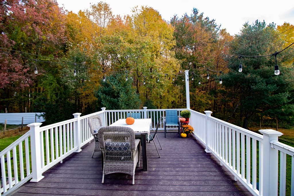 96 Cold Hill Granby, MA 01033 - Photo 14 of 42 a view of a table and chairs on the roof deck