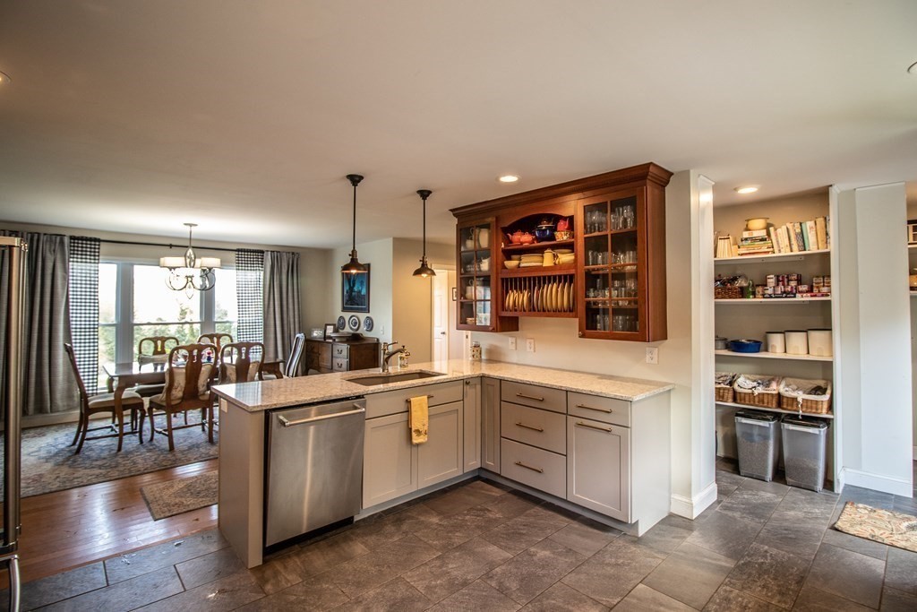 96 Cold Hill Granby, MA 01033 - Photo 20 of 42 a kitchen with a sink and chairs