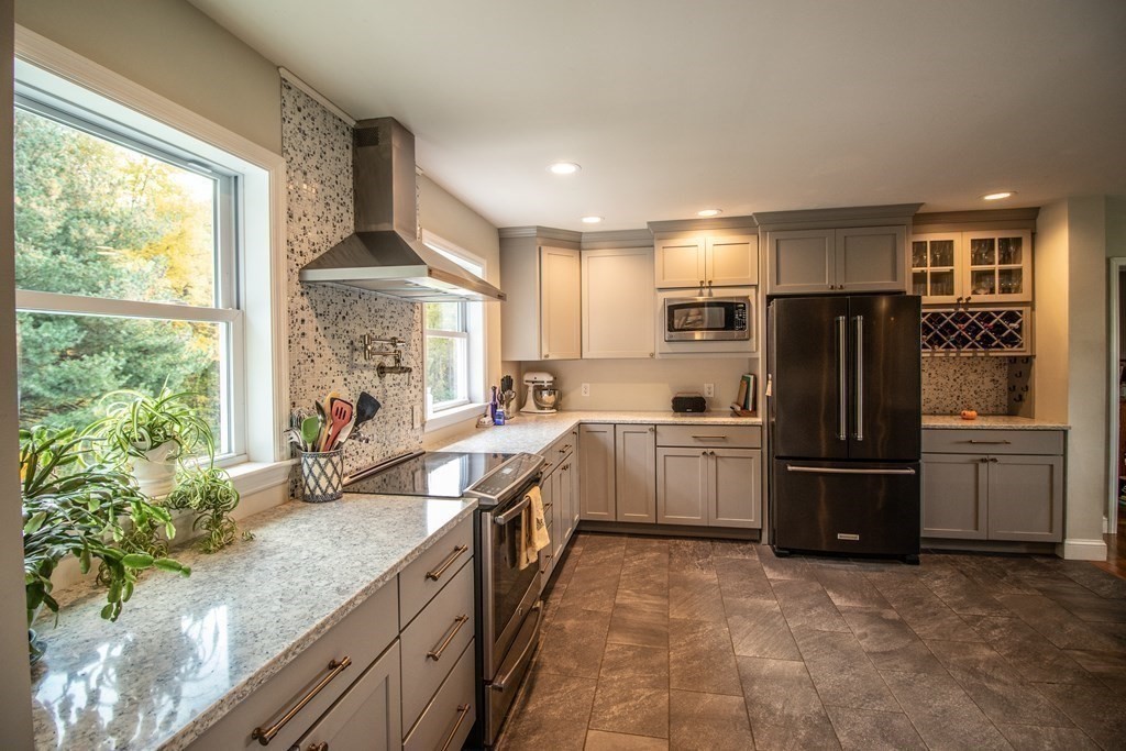 96 Cold Hill Granby, MA 01033 - Photo 23 of 42 a kitchen with a refrigerator and a sink