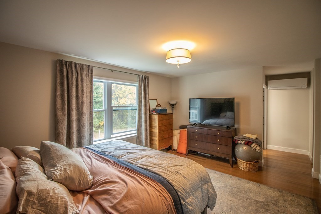 96 Cold Hill Granby, MA 01033 - Photo 30 of 42 a bedroom with a bed and a television