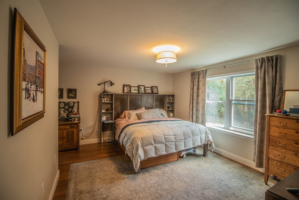 96 Cold Hill Granby, MA 01033 - Photo 32 of 42 a bedroom with a large bed and a window