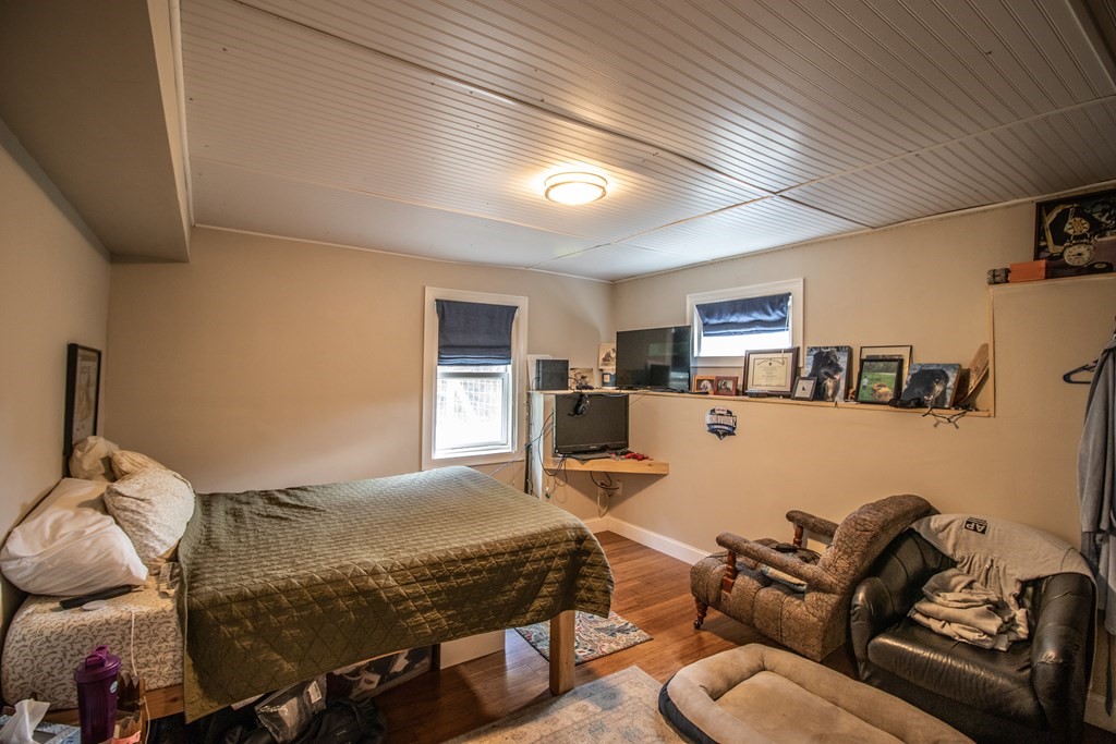 96 Cold Hill Granby, MA 01033 - Photo 36 of 42 a bedroom with furniture and a tv