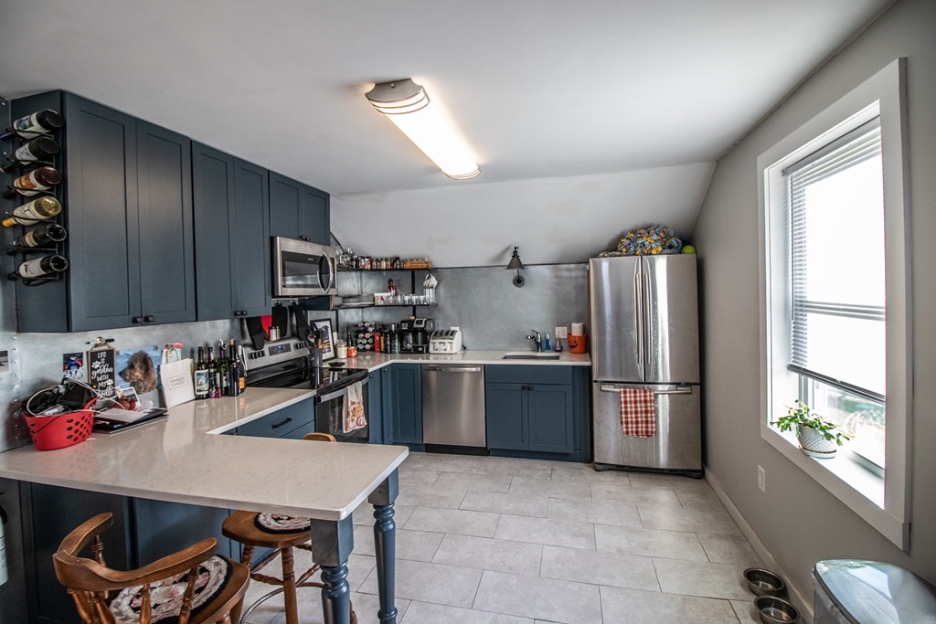 96 Cold Hill Granby, MA 01033 - Photo 38 of 42 a kitchen with refrigerator and window