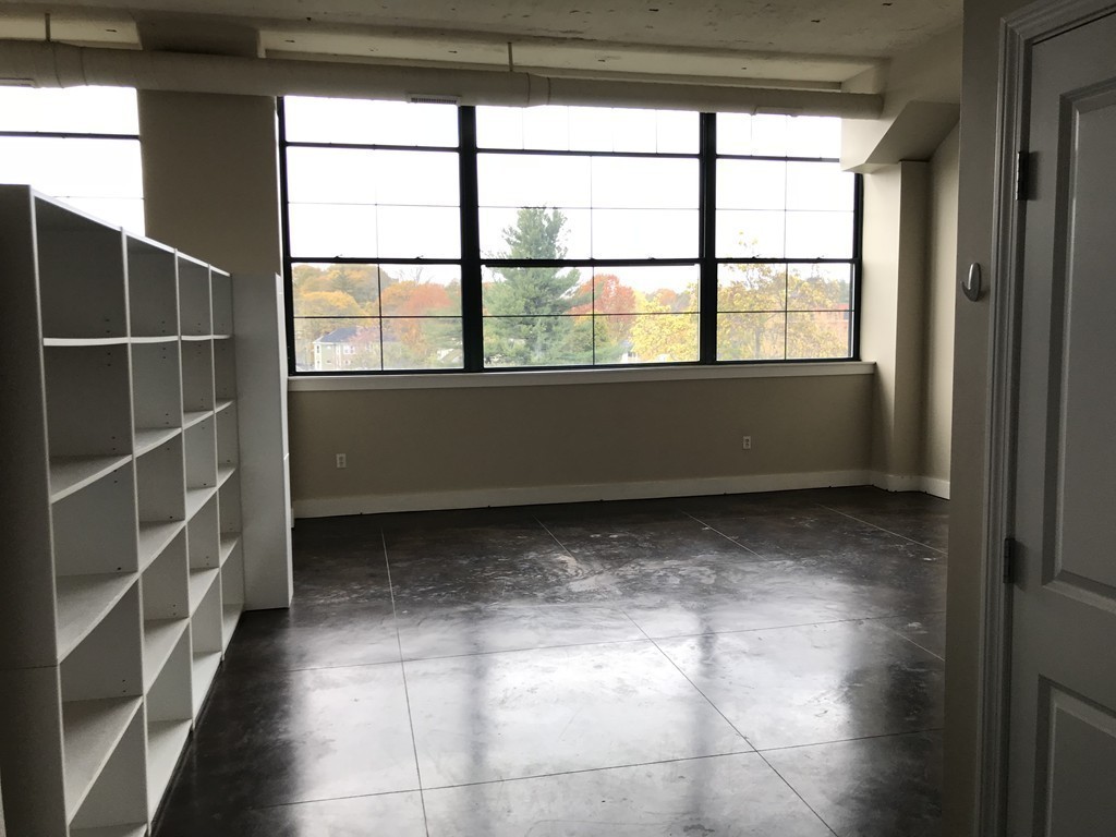 21 Illinois Street, Unit 402 Worcester, MA 01610 - Photo 6 of 16 a room with a large window
