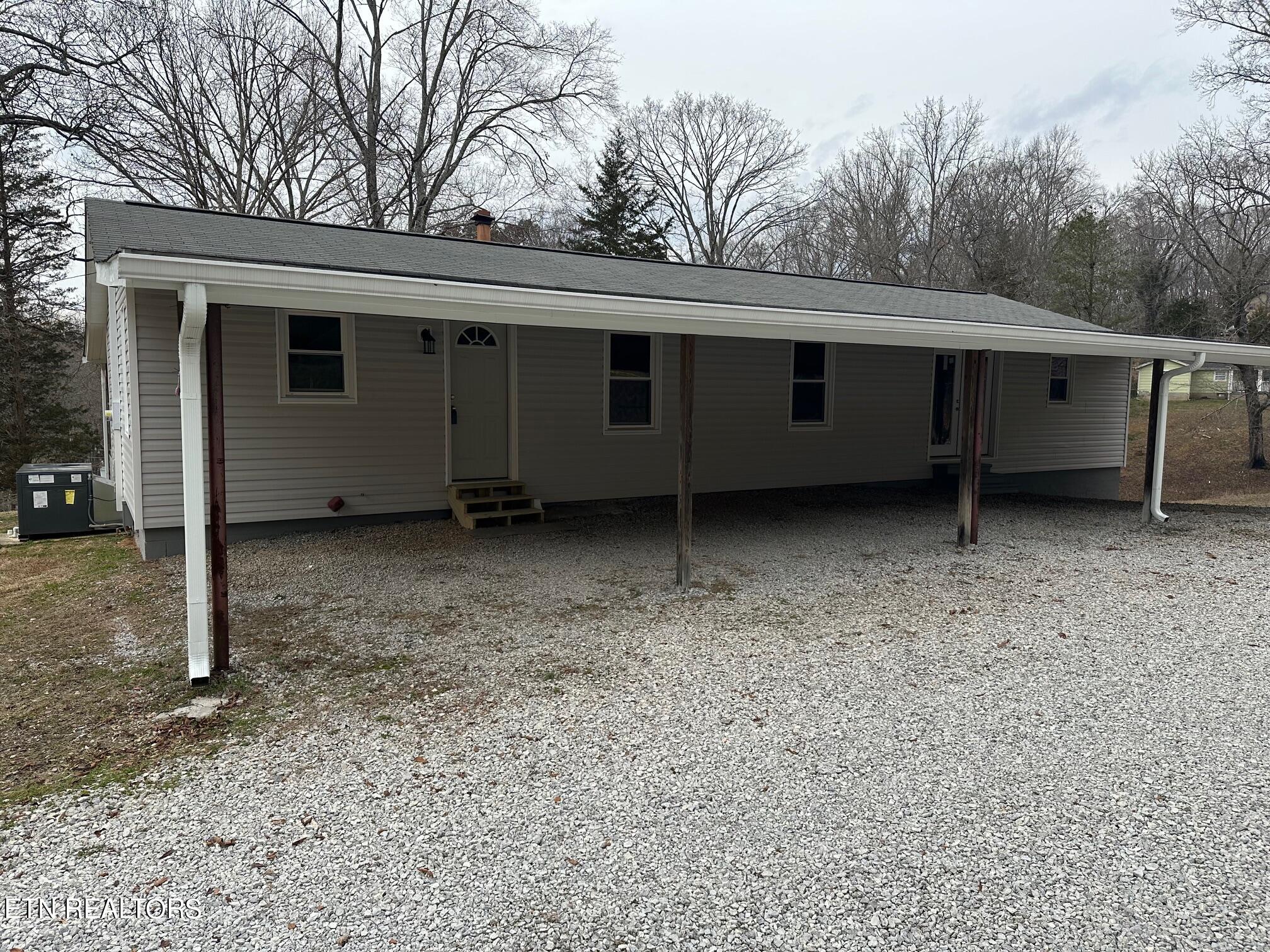 114 Martin Strader Lane Clinton, TN 37716 - Photo 6 of 34 6 Back with carport area
