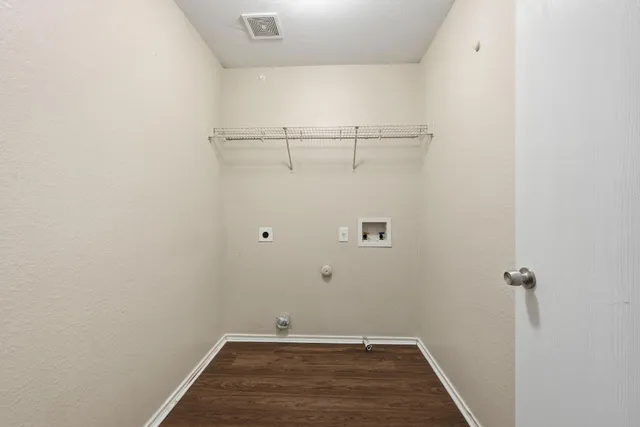 a view of a room with racks on the wall