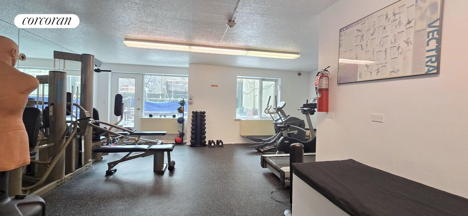 225 8th Avenue, Unit 5E Manhattan, NY 10011 - Photo 11 of 13 a view of a room with gym equipment