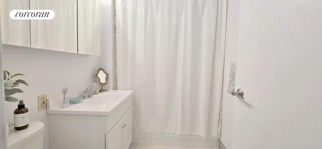 a bedroom with a bed and a flat screen television