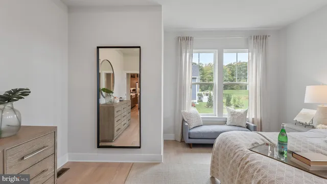 a spacious bathroom with a granite countertop sink a toilet a shower and a mirror
