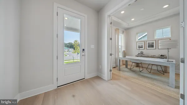 a view of entryway with wooden floor and window