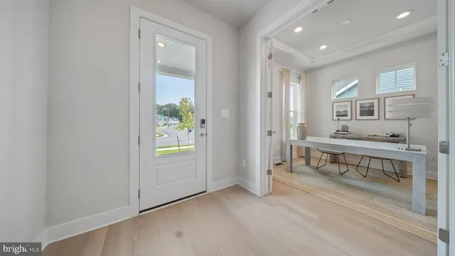 a view of entryway with wooden floor and window