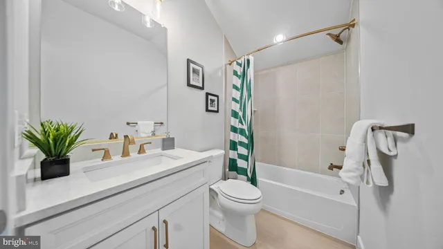a utility room with sink dryer and washer