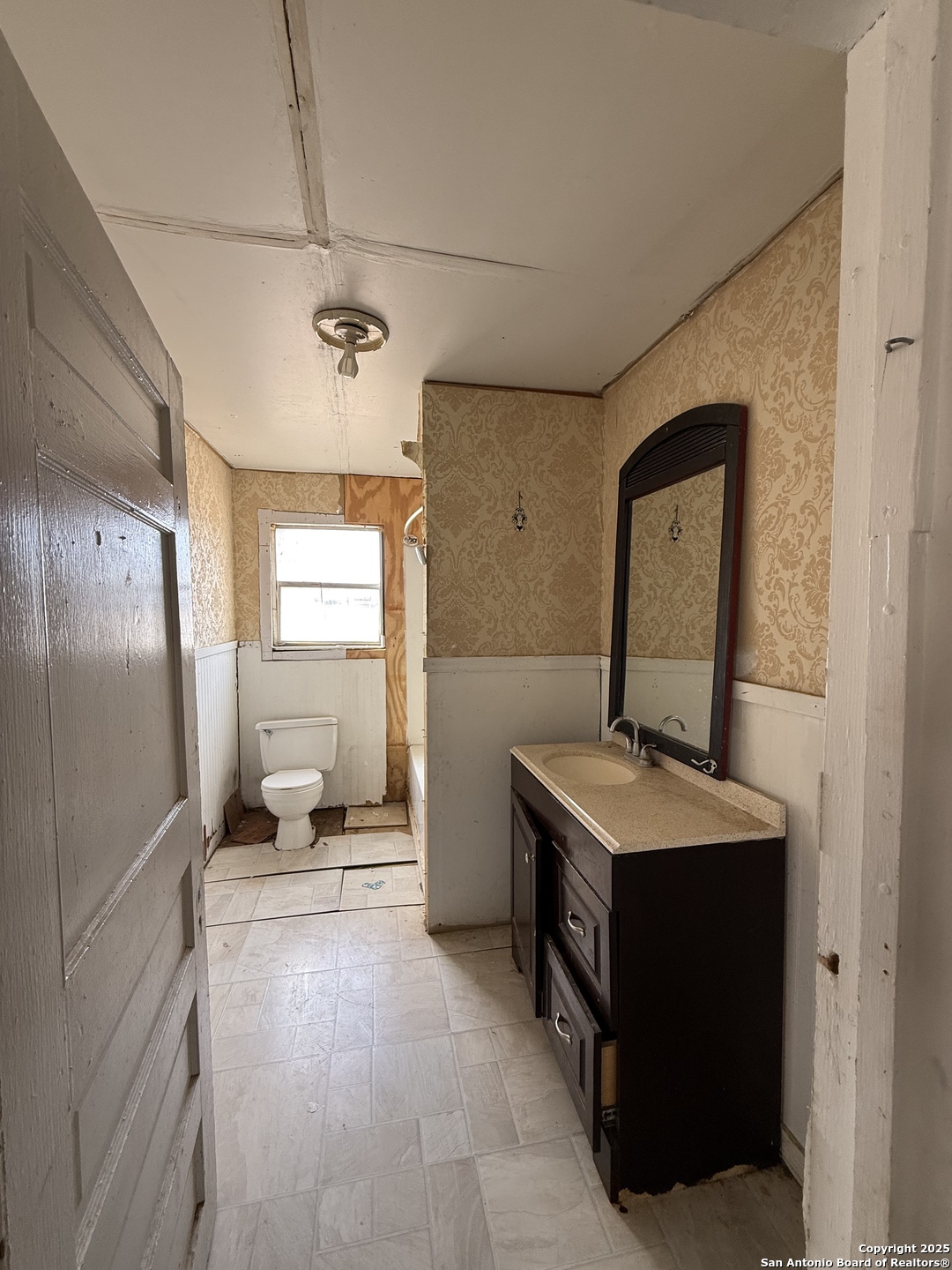 279 Cenizo Street Carrizo Springs, TX 78834 - Photo 9 of 13 a bathroom with a sink toilet and mirror