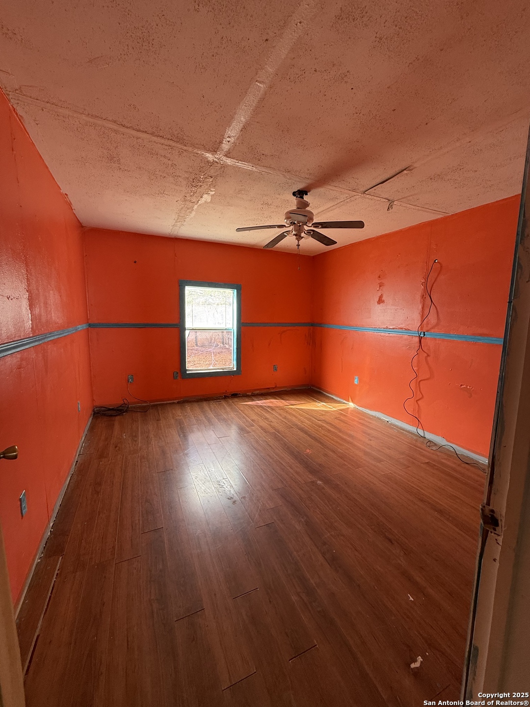 279 Cenizo Street Carrizo Springs, TX 78834 - Photo 10 of 13 a view of an empty room with a window
