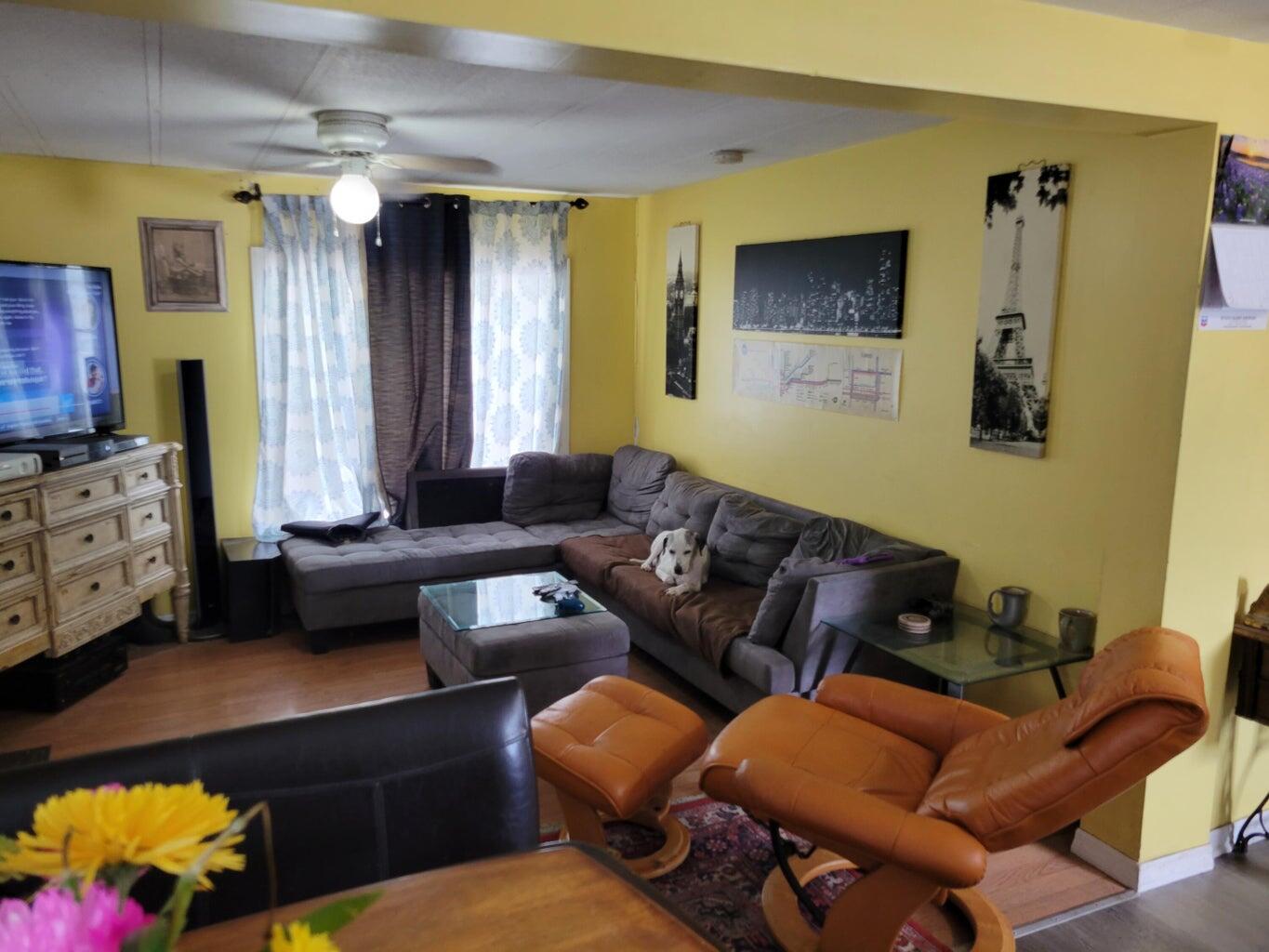 C1 9th Avenue Key West, FL 33040 - Photo 5 of 8 a living room with furniture and a window