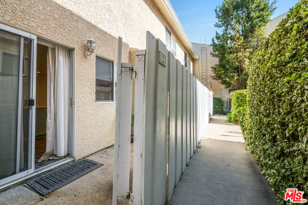 4558 Willis Avenue, Unit 121 Sherman Oaks, CA 91403 - Photo 14 of 34 a view of a house with a backyard