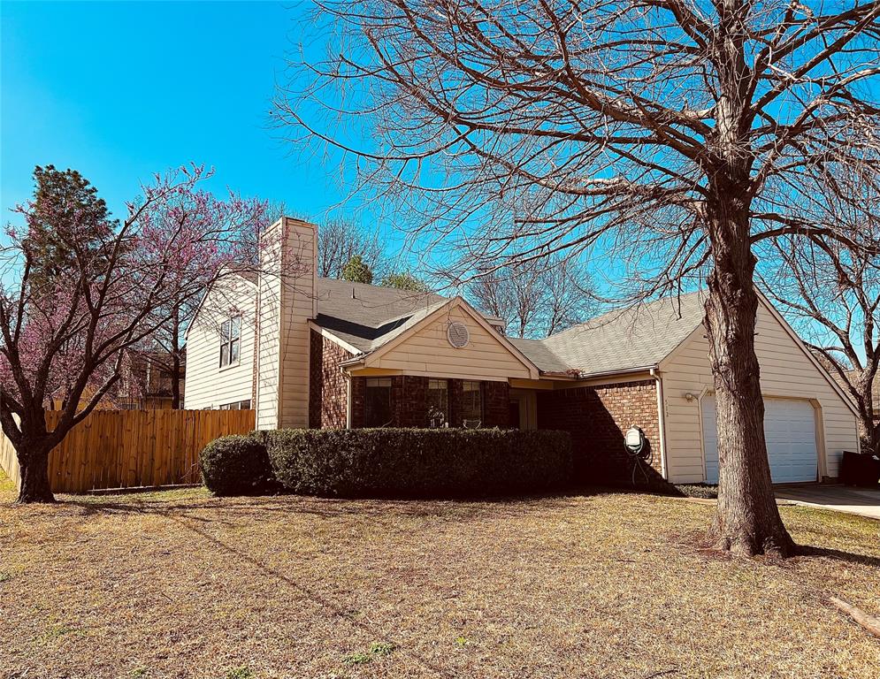 512 Sage Lane Euless, TX 76039 - Photo 1 of 1 a front view of a house with a yard
