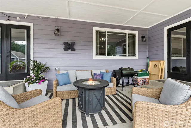a view of swimming pool with outdoor seating and green space