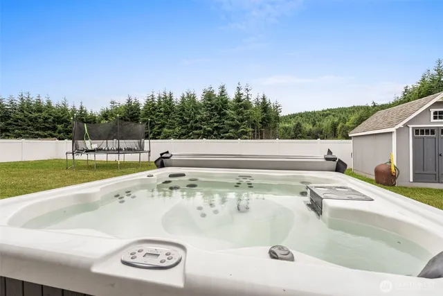 a view of a house with a backyard and porch