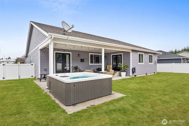 a view of a house with a backyard