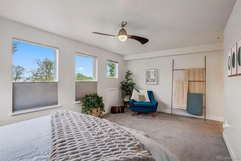 a bedroom with furniture and a window