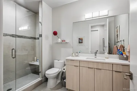 a bedroom with a bed and dresser