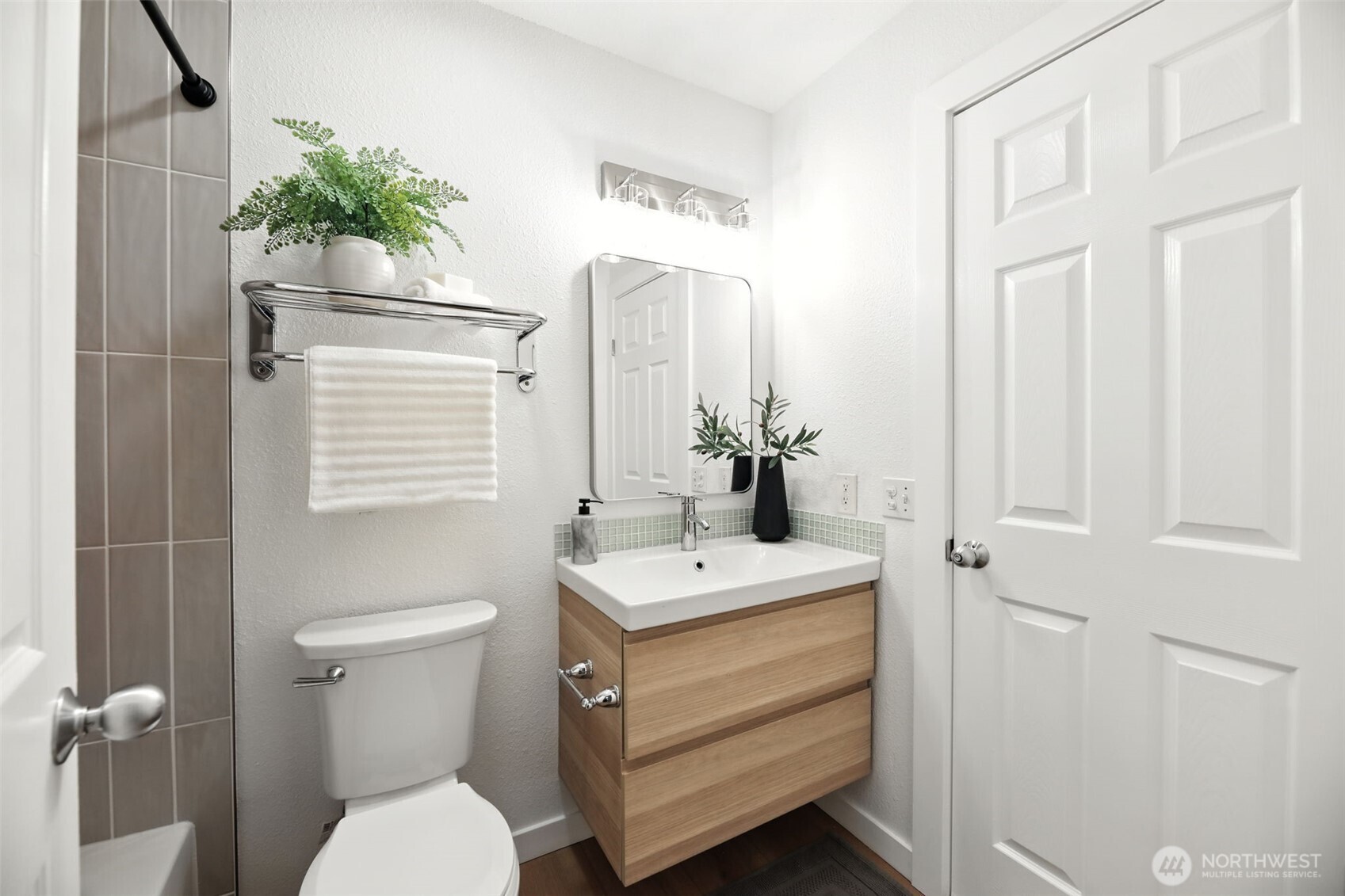 3233 Northeast 12th Street, Unit 207 Renton, WA 98056 - Photo 21 of 40 a bathroom with a sink toilet and shower