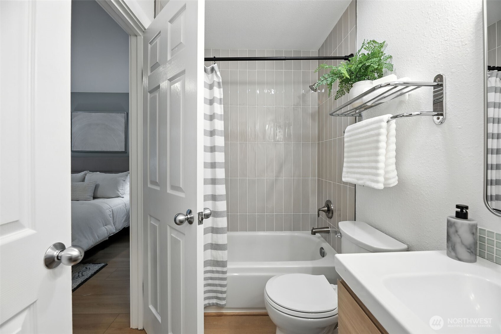 3233 Northeast 12th Street, Unit 207 Renton, WA 98056 - Photo 23 of 40 a bathroom with a sink toilet and shower