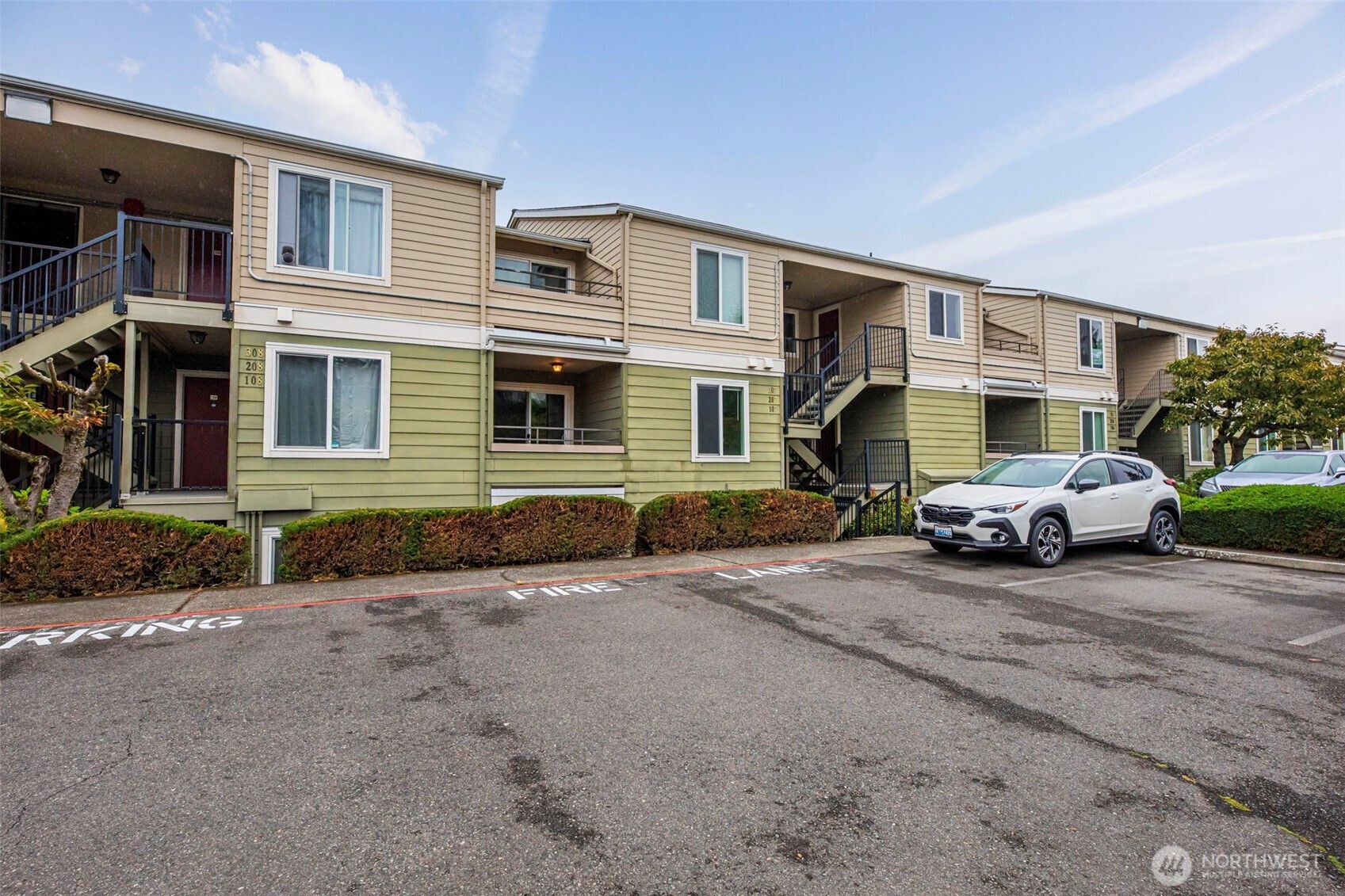 3233 Northeast 12th Street, Unit 207 Renton, WA 98056 - Photo 30 of 40 a view of a car park in front of house