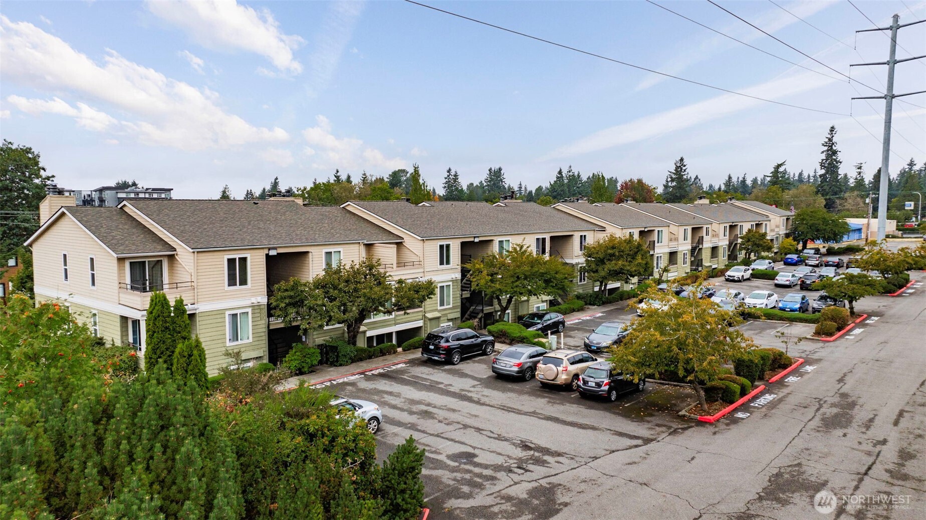 3233 Northeast 12th Street, Unit 207 Renton, WA 98056 - Photo 31 of 40 a front view of a house with garden