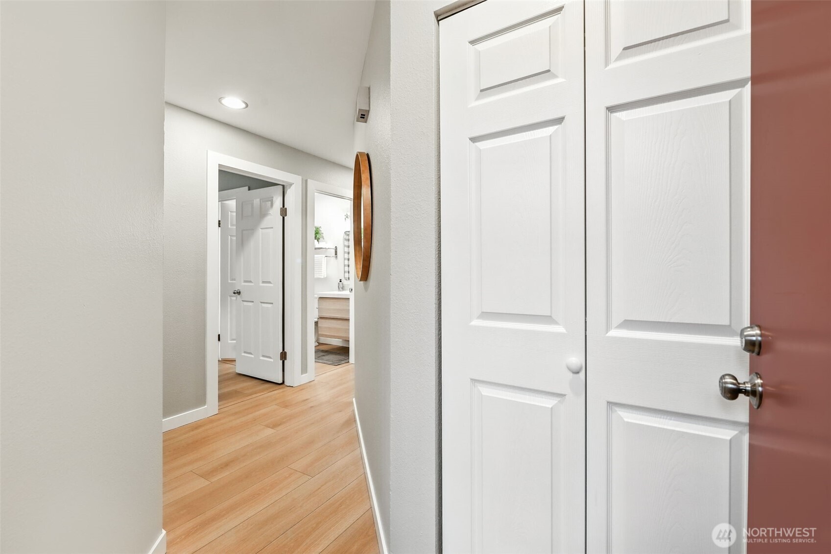 3233 Northeast 12th Street, Unit 207 Renton, WA 98056 - Photo 4 of 40 a view of a hallway with wooden floor