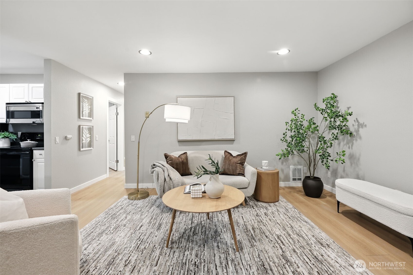 3233 Northeast 12th Street, Unit 207 Renton, WA 98056 - Photo 6 of 40 a living room with furniture and a couch