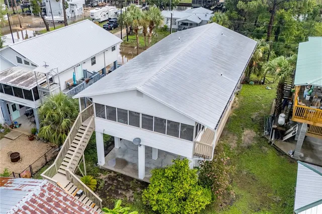 an aerial view of a house having outdoor space patio