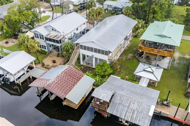 an aerial view of a house with outdoor space