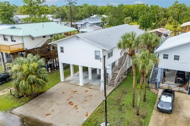 an aerial view of houses with outdoor space