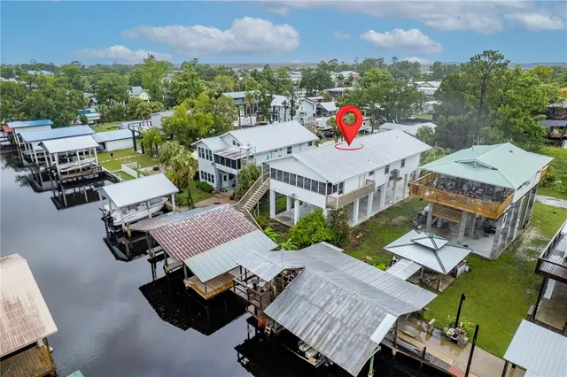 an aerial view of a houses with city view and lake view