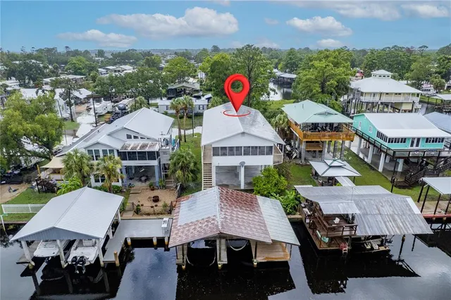 an aerial view of multiple houses with yard