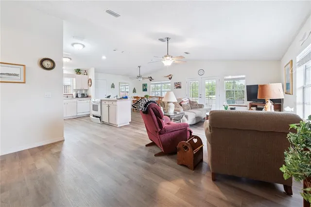 a kitchen with white cabinets sink and stainless steel appliances