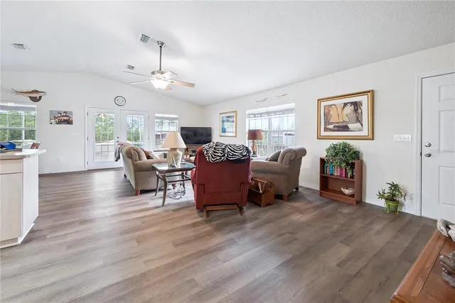 a kitchen with white cabinets appliances and sink