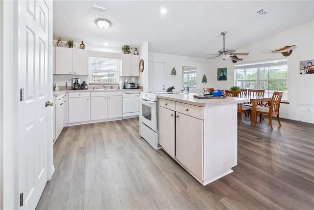 a open kitchen with stainless steel appliances granite countertop a stove and cabinets