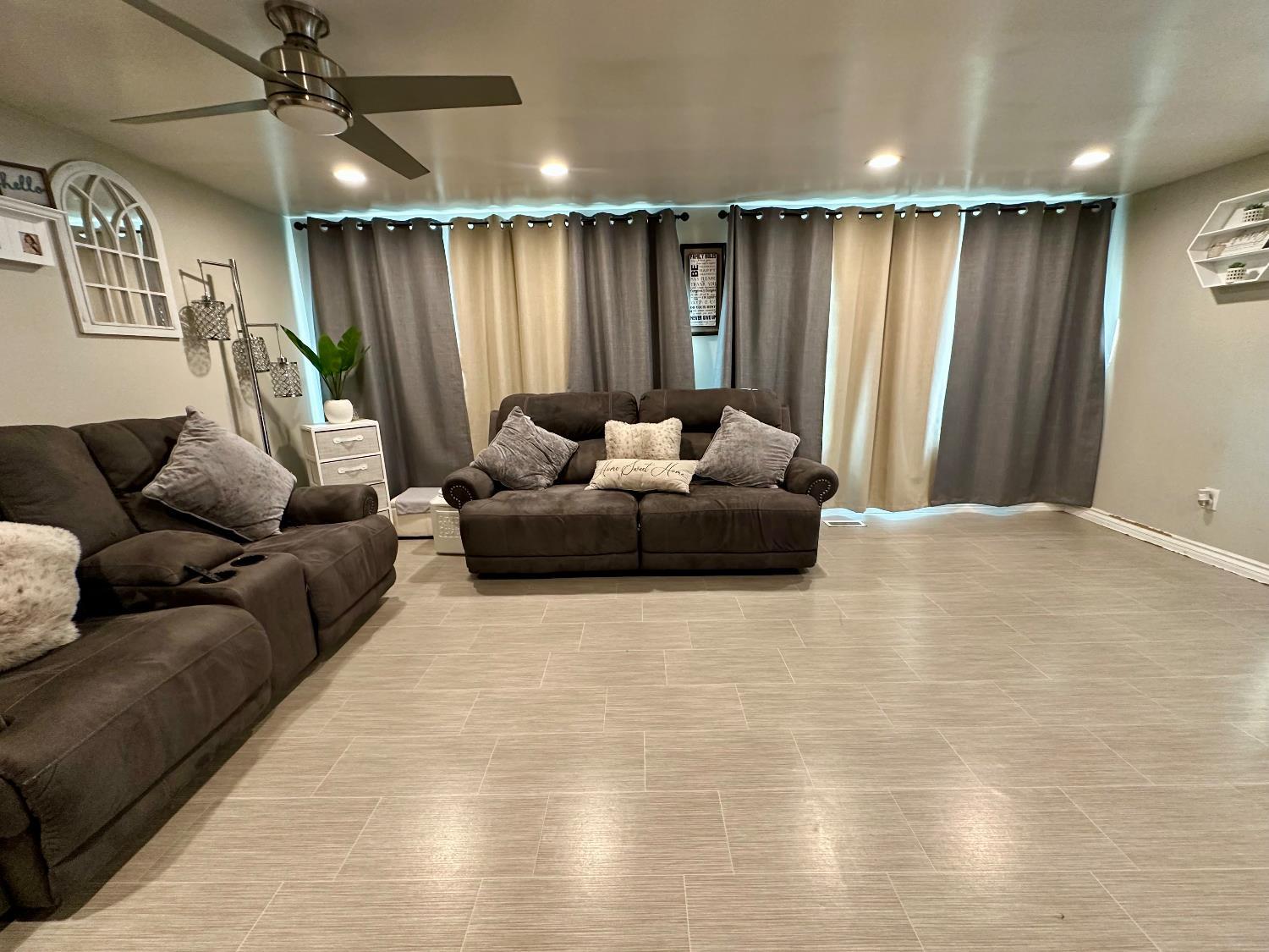 3435 Marfargoa Road, Unit 74 Stockton, CA 95215 - Photo 5 of 21 a living room with furniture and a large window