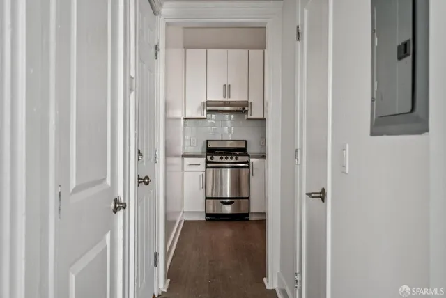 a kitchen with a sink cabinets and a window