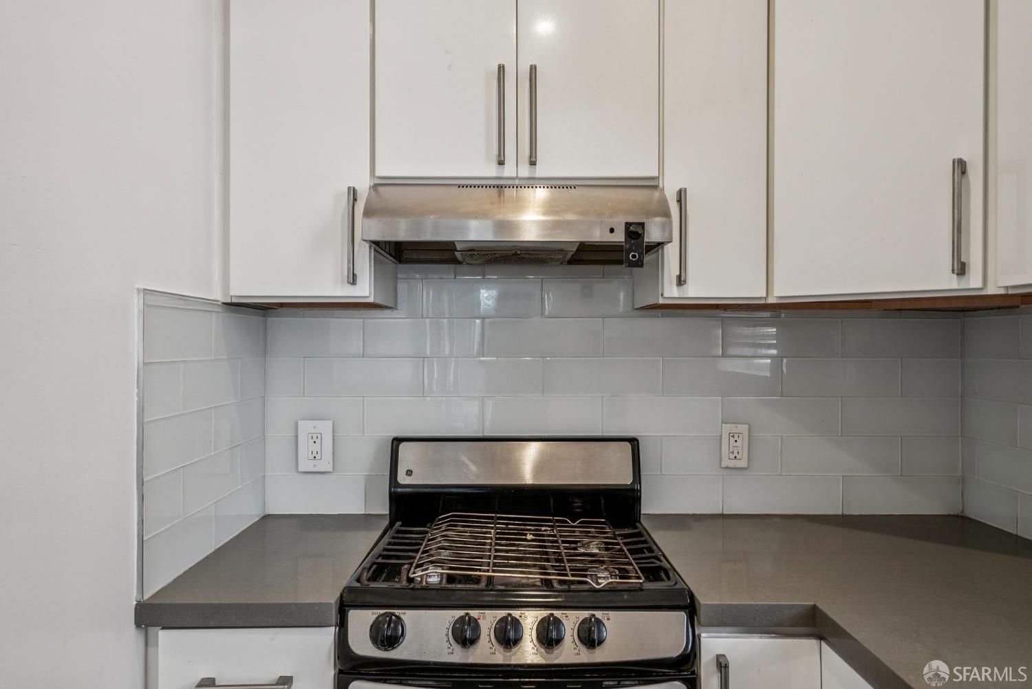 669 Ellis Street San Francisco, CA 94109 - Photo 27 of 32 a stove top oven sitting inside of a kitchen