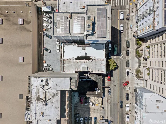 a picture of a bathroom with a lot of storage