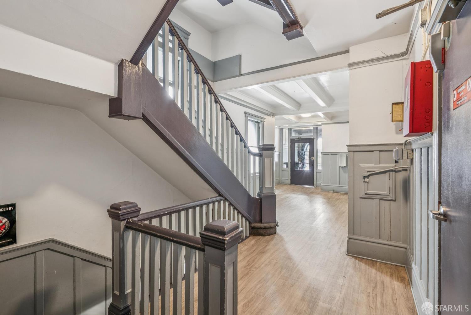 669 Ellis Street San Francisco, CA 94109 - Photo 7 of 32 a view of staircase with wooden floor and white walls