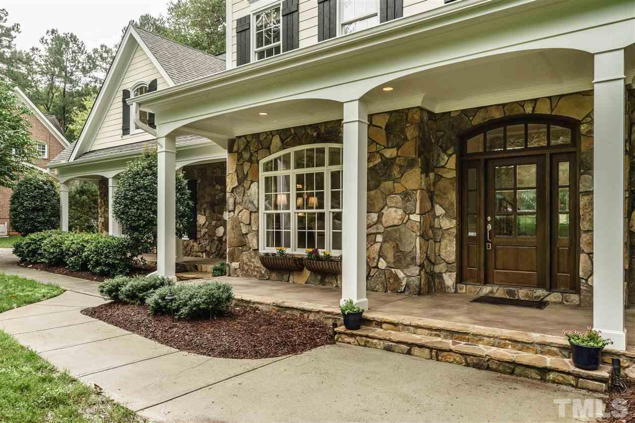 1801 Bowling Green Trail Raleigh, NC 27613 - Photo 2 of 25 a front view of a building with a outdoor space