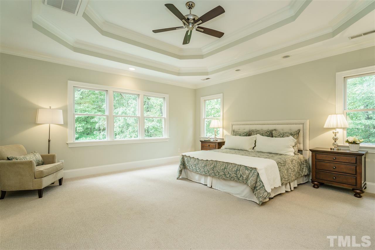 1801 Bowling Green Trail Raleigh, NC 27613 - Photo 12 of 25 a spacious bedroom with a bed and a window