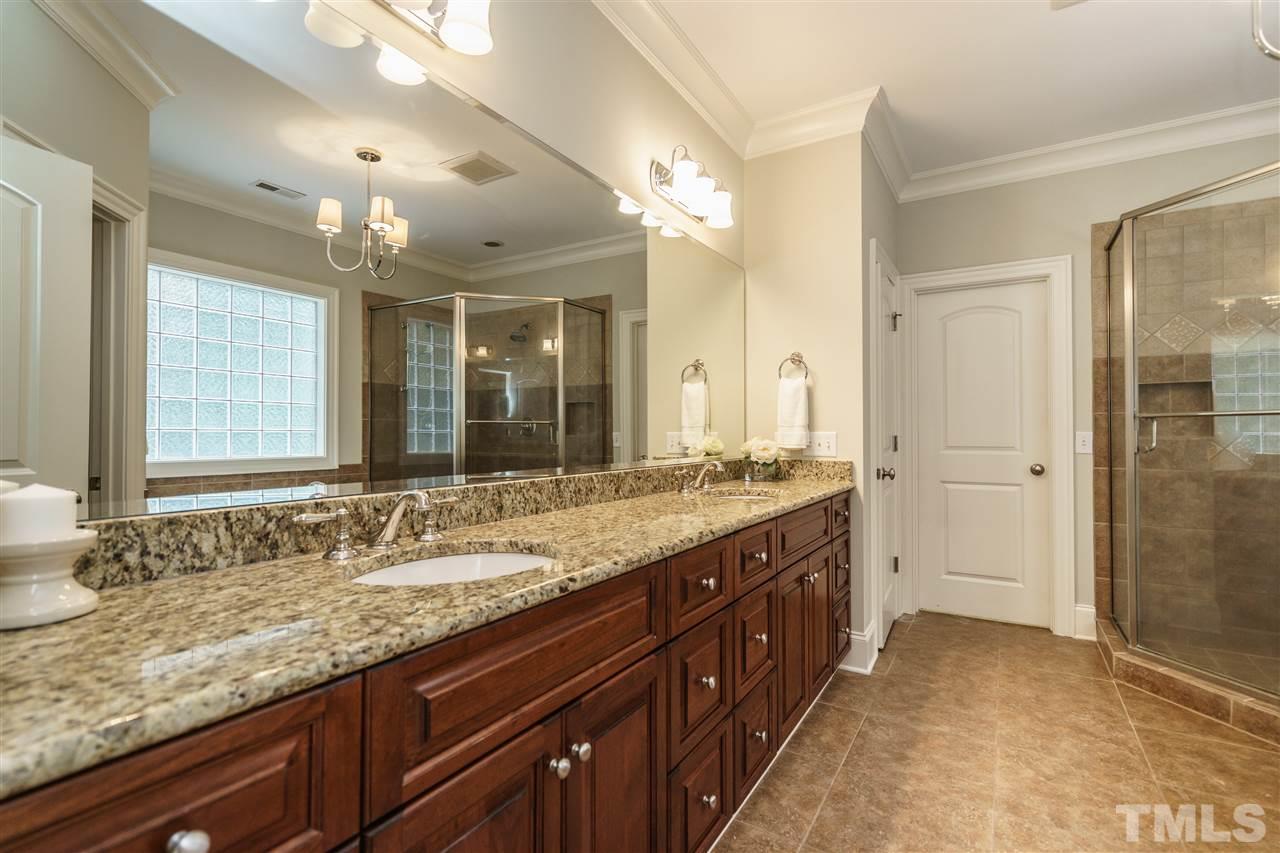 1801 Bowling Green Trail Raleigh, NC 27613 - Photo 14 of 25 a bathroom with a granite countertop sink mirror and double