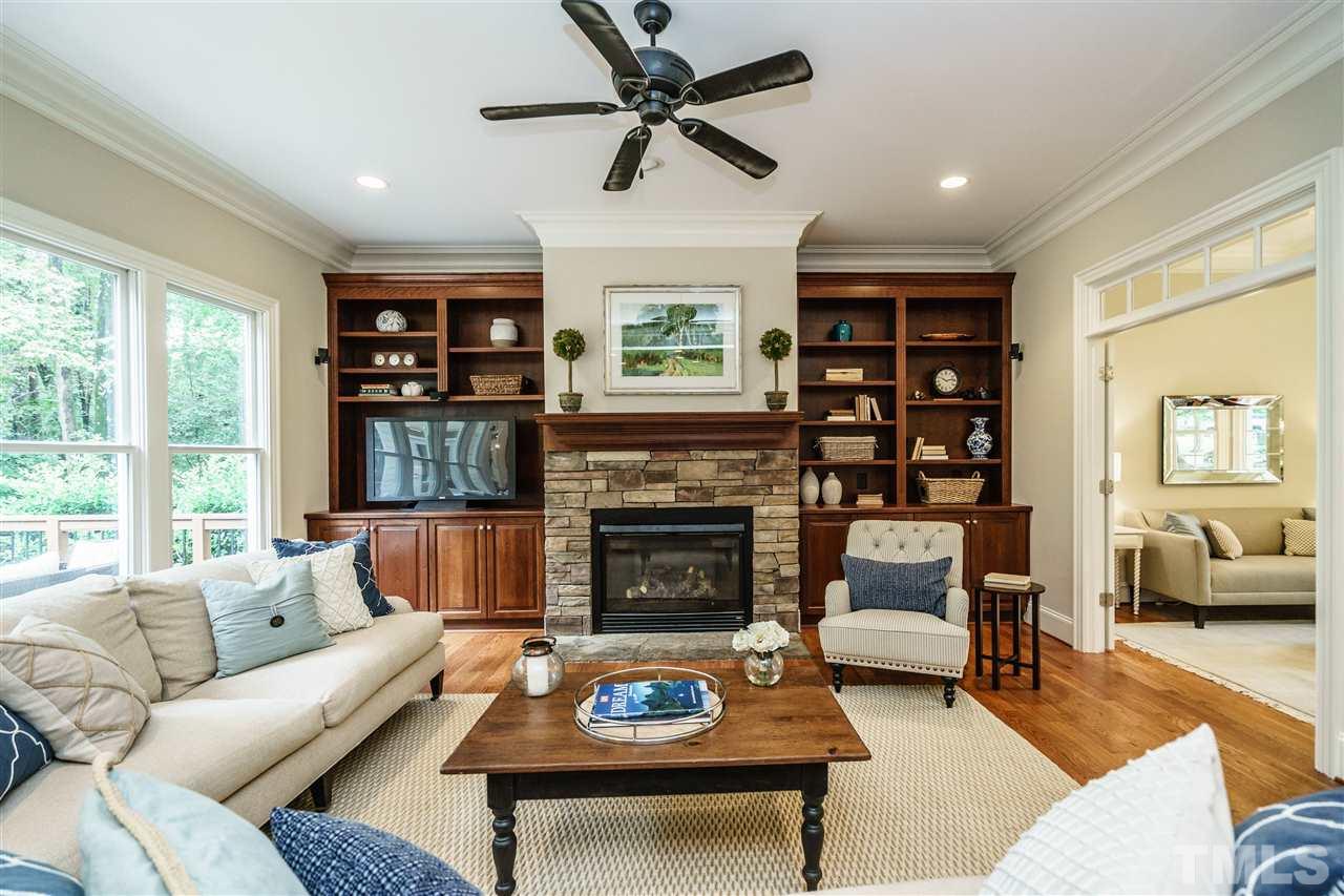 1801 Bowling Green Trail Raleigh, NC 27613 - Photo 7 of 25 a living room with furniture fireplace and a large window
