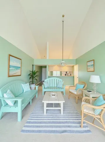 a view of a swimming pool with an outdoor seating and a yard